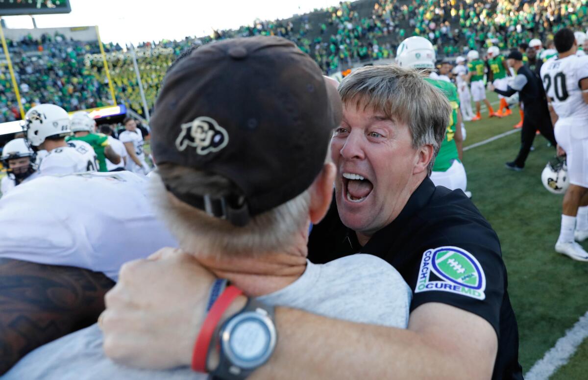Colorado Coach Mike MacIntyre rejoices after the Buffaloes' win over Oregon on Sept. 24.