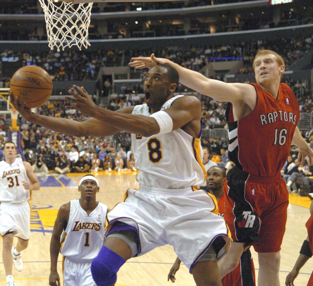 Toronto's Matt Bonner reaches for the ball just before Kobe Bryant scores two of his 81 points against the Raptors on Jan. 22, 2006.