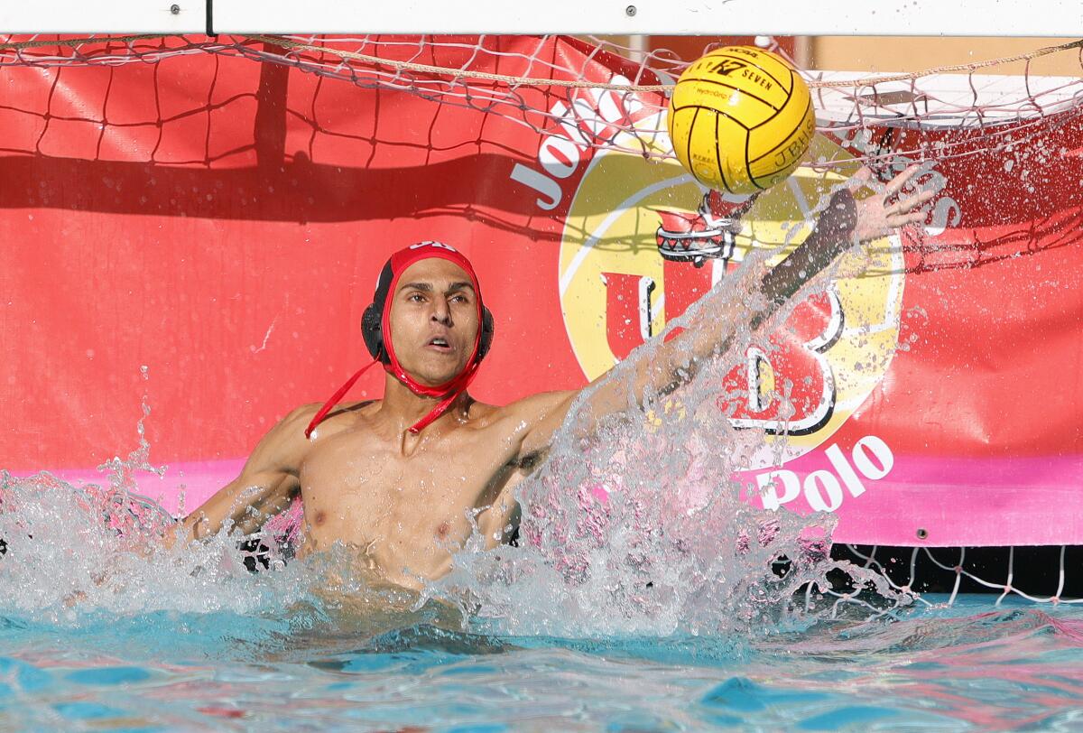 Burroughs' goalie David Karagezyan reaches out in an attempt to block a Glendale shot in a Pacific League boys' water polo match at Burroughs High School on October 1, 2019. Glendale won the match 10-8.