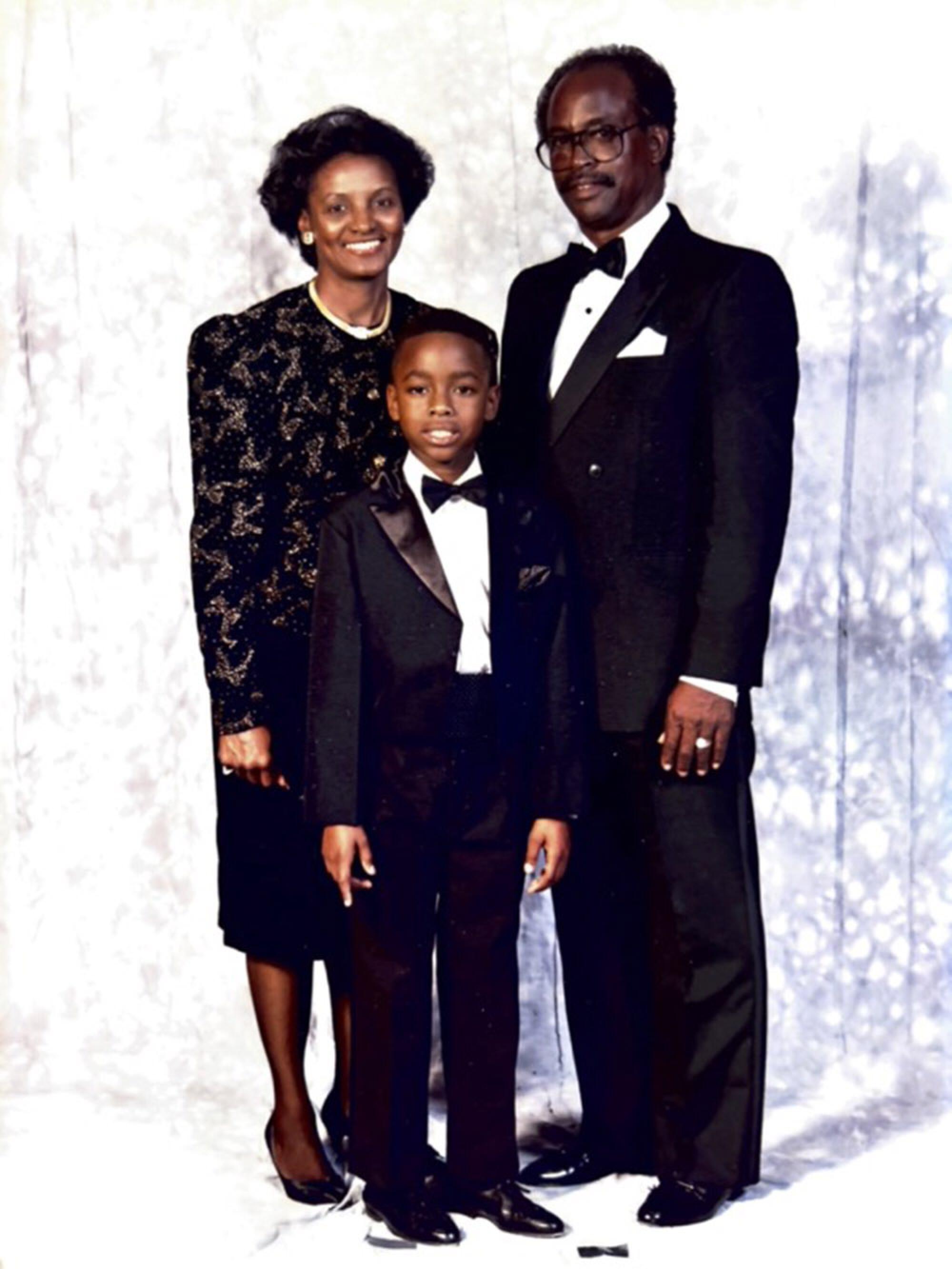 Stanley Wilson Jr., middle, stands next to his grandparents, Beverly, left, and Henry Wilson, right.