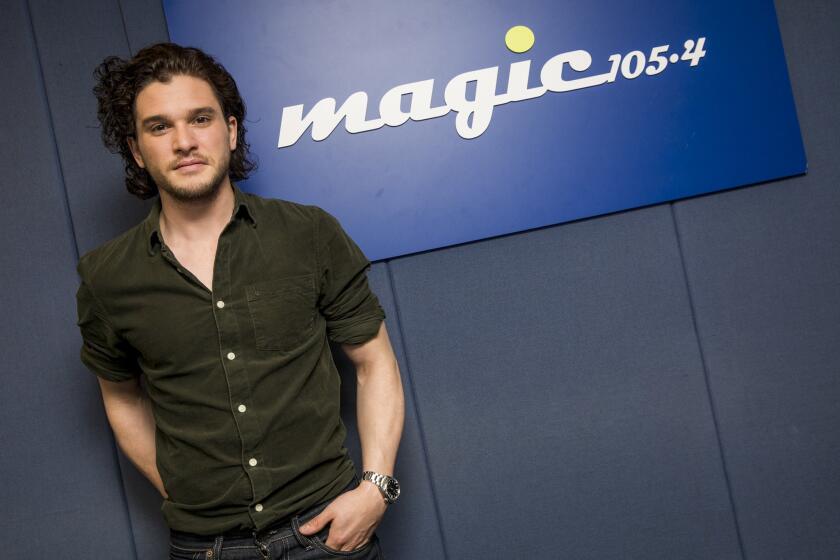 Actor Kit Harington, shown during a visit in April to a London radio station, must keep his hair on the long side.