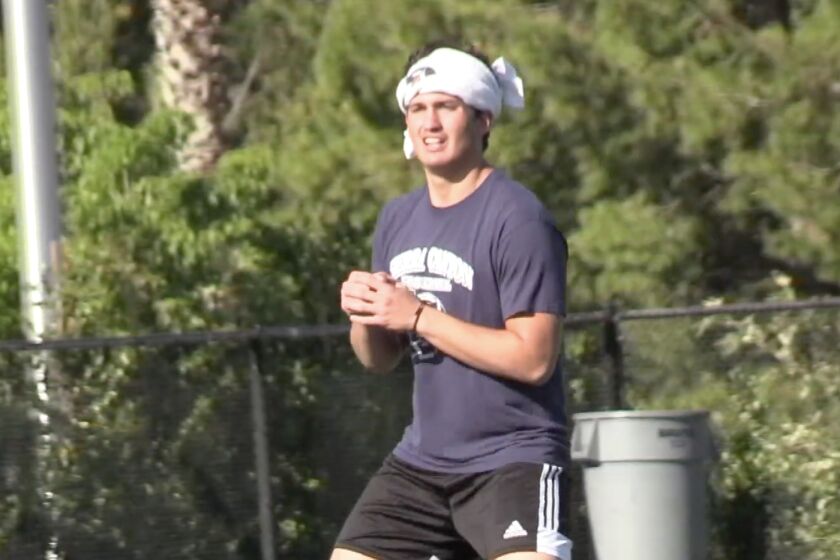 Quarterback Chayden Peery of Sierra Canyon practicing throwing without a ball last June when balls were not permitted.