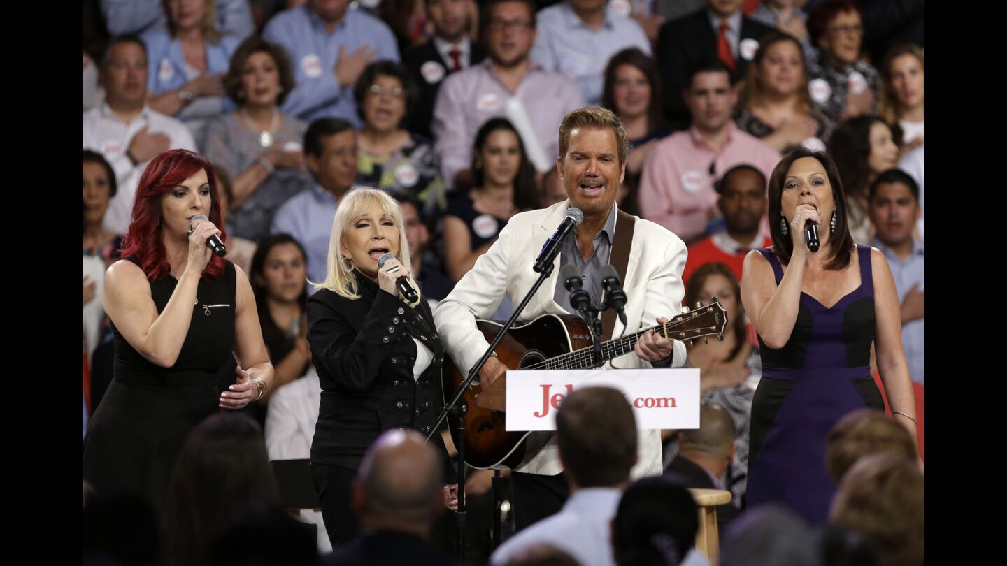 Musician Willy Chirino, second from right, performs with his family before former Florida Gov. Jeb Bush officially announced his bid for the Republican presidential nomination on Monday in Miami.