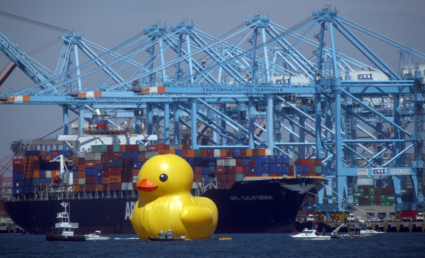 A giant rubber duck passes through the Port of Los Angeles as part of the Festival of Tall Ships.
