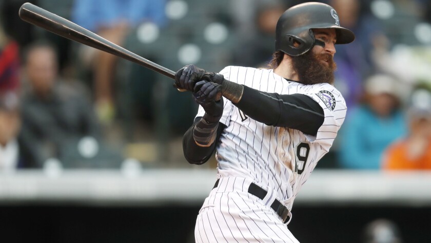 Rockies center fielder Charlie Blackmon singles against the Marlins to drive in his 100th run on Wednesday. He homered against the Dodgers on Friday for his 101st RBI.