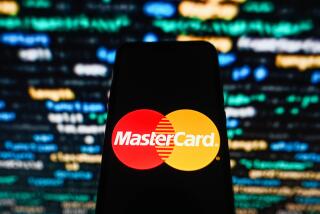 POLAND - 2023/10/23: In this photo illustration, a Mastercard logo seen displayed on a smartphone with coding in the background. (Photo Illustration by Omar Marques/SOPA Images/LightRocket via Getty Images)