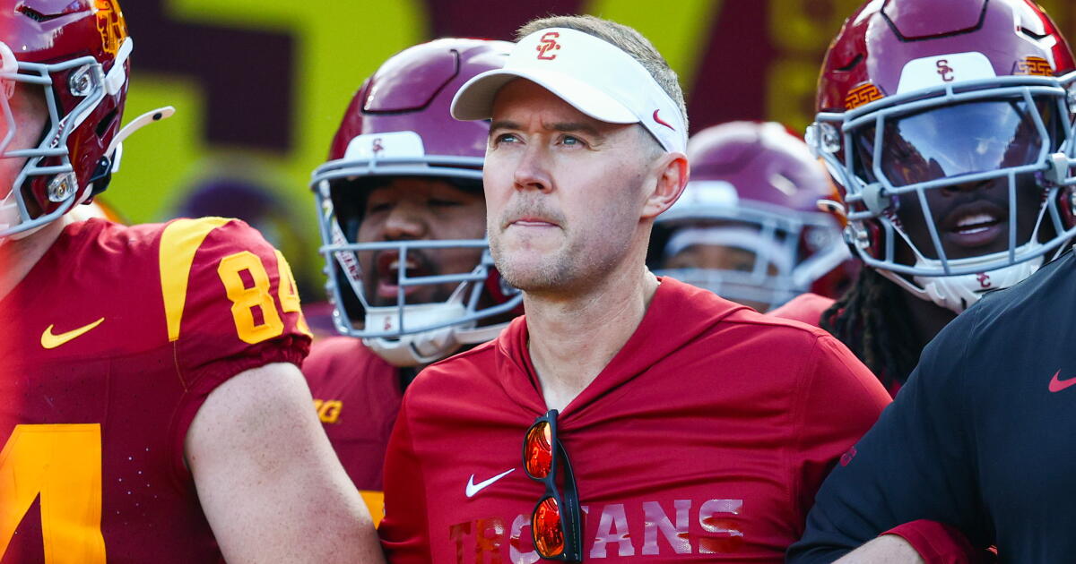 Photo: Los Angeles Times USC coach Lincoln Riley walks out of the tunnel with his team before the Trojans' loss to Oregon Saturday