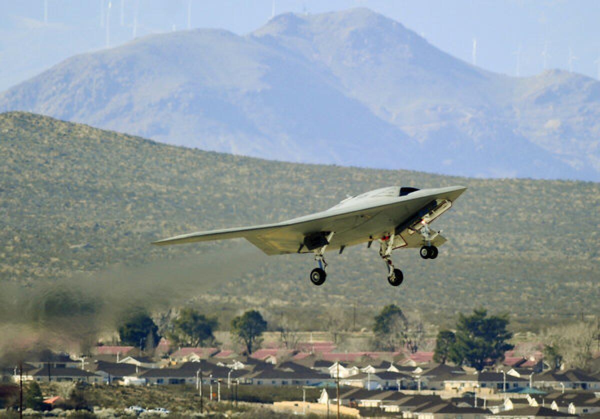 The U.S. Navy's X-47B unmanned combat aircraft, as shown in a 2011 file photo. The super drone being developed by Northrop Grumman was test-flown from an aircraft carrier two weeks ago, spurring peace and human rights activists' concern about the morality and legality of deploying lethal autonomous weapons, or "killer robots."