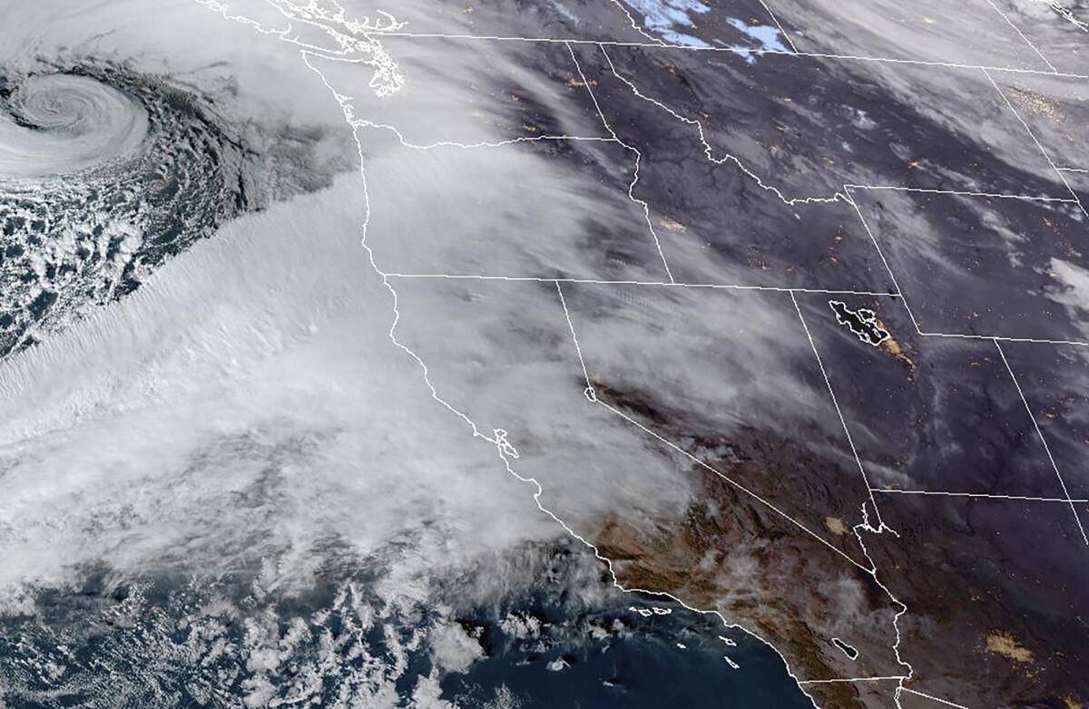 Satellite image provided by NOAA shows an atmospheric river moving in on Northern California.