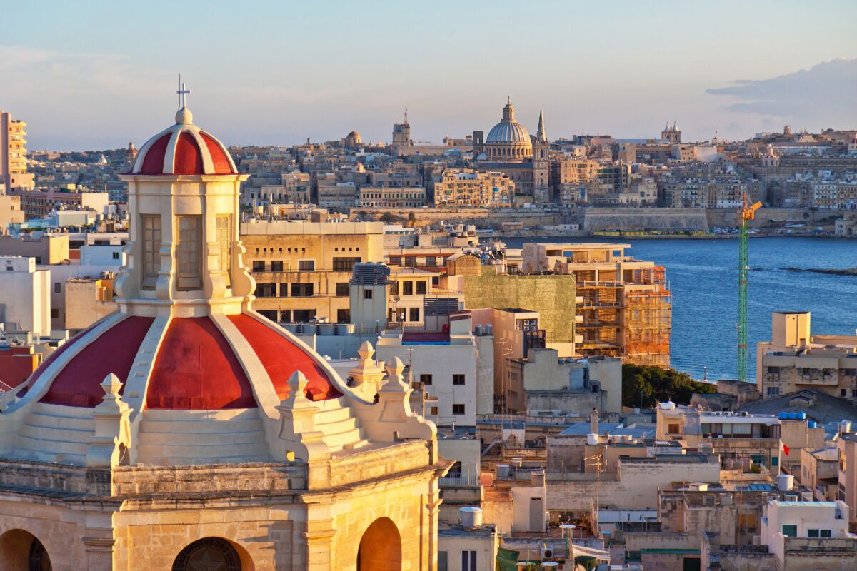 A view from The Palace in Sliema over Valletta with a church in the foreground.