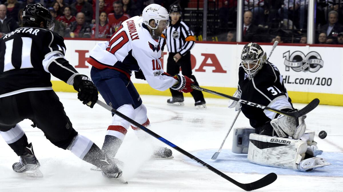 Capitals right wing Brett Connolly (10) scores a goal against Kings goalie Peter Budaj (31) and center Anze Kopitar (11) during the second period Sunday.