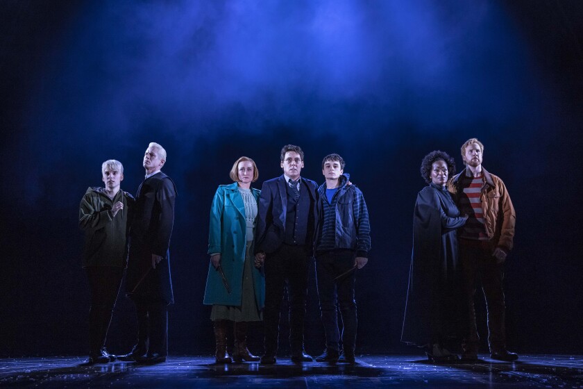 The "Harry Potter and the Cursed Child" cast stands in groups onstage.