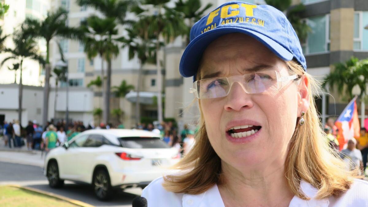 Carmen Yulin Cruz, the mayor of San Juan, Puerto Rico's capital, speaks to the media before Tuesday's marches.