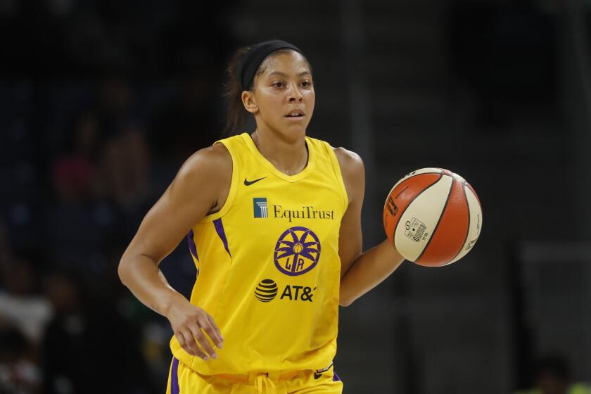 Los Angeles Sparks' Candace Parker advances the ball during the second half of a WNBA basketball game against the Chicago Sky Friday, Aug. 16, 2019, in Chicago. (AP Photo/Charles Rex Arbogast)
