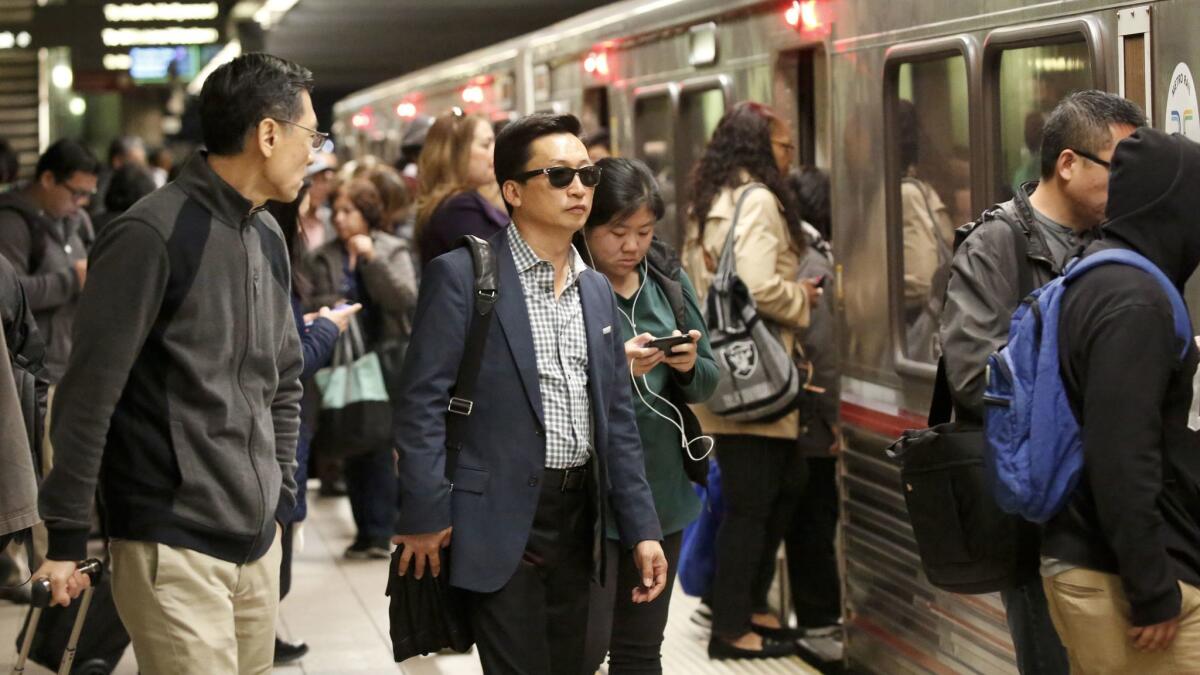 Commuters pass through Union Station in downtown Los Angeles. The president's executive order has been disorienting to many in and around Los Angeles — in part, they say, because their lives intersect with so many people of so many cultures.