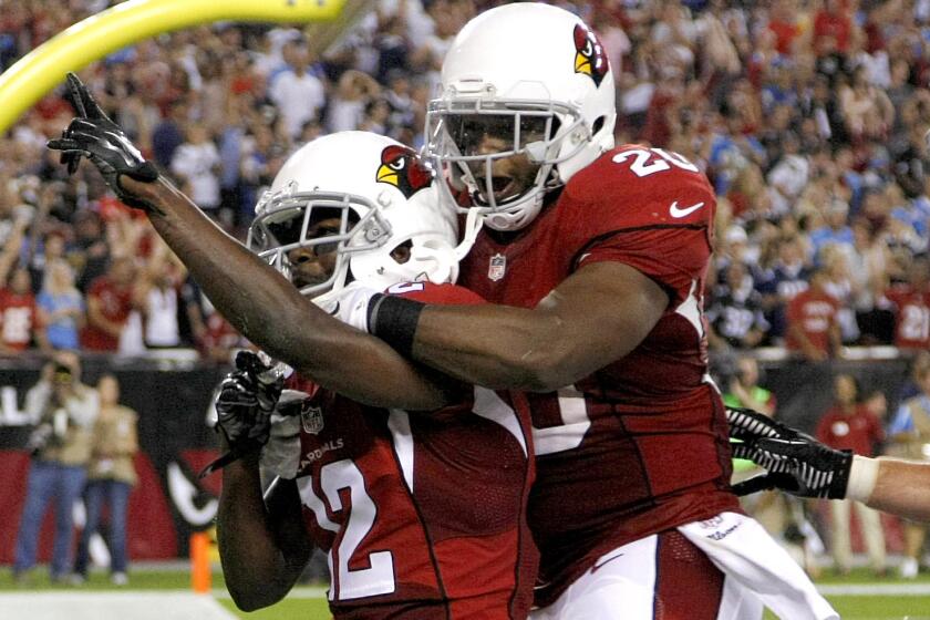 Arizona Cardinals wide receiver John Brown, left, celebrates with teammate Jonathan Dwyre after scoring on a touchdown catch in the fourth quarter of an 18-17 victory over the San Diego Chargers on Monday.