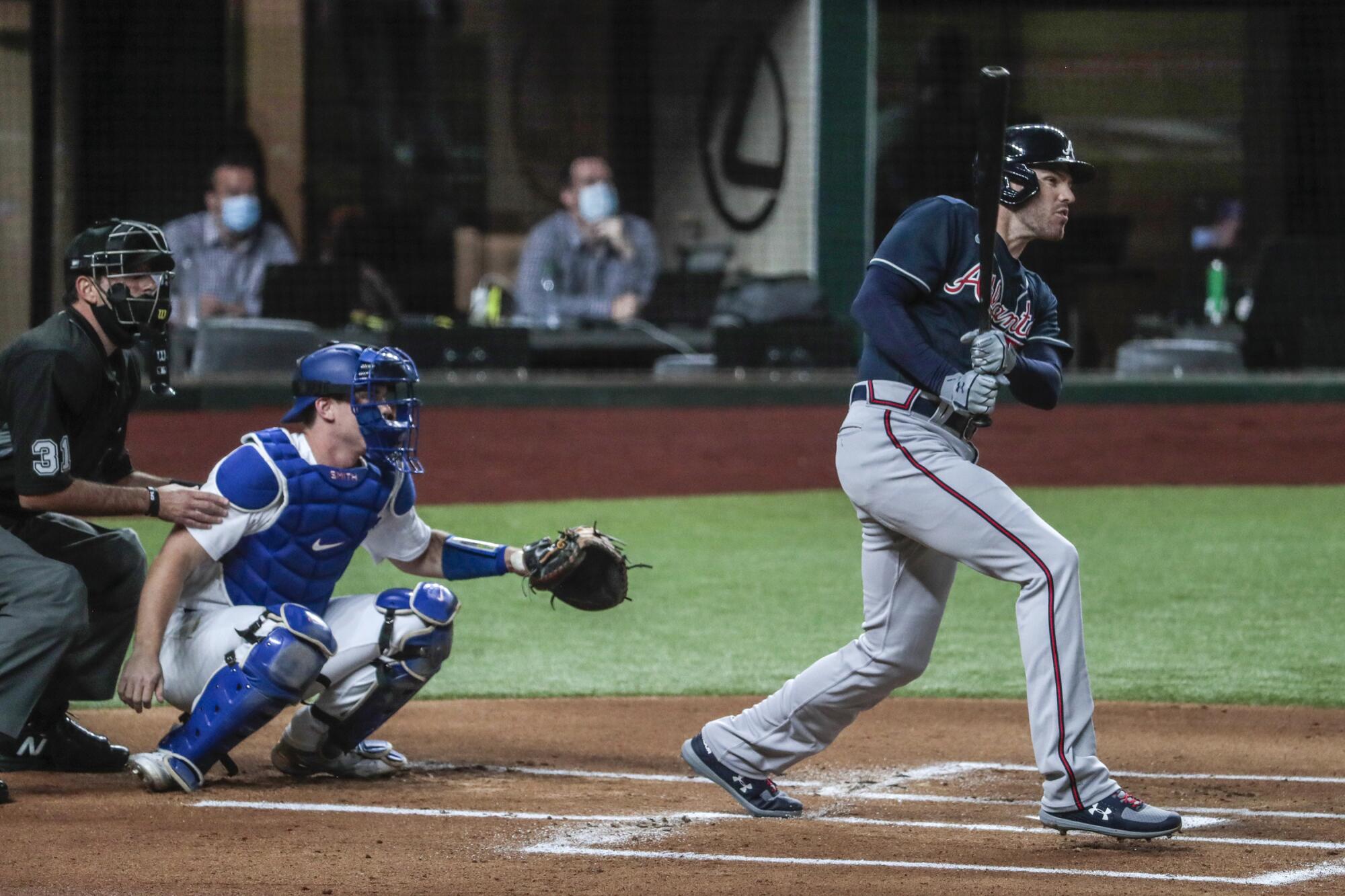 Atlanta Braves first baseman Freddie Freeman homers off Dodgers starting pitcher Walker Buehler during Game 1 of the NLCS.