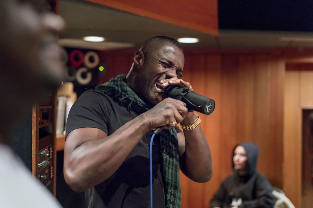 Idris Elba records vocals for a new song.