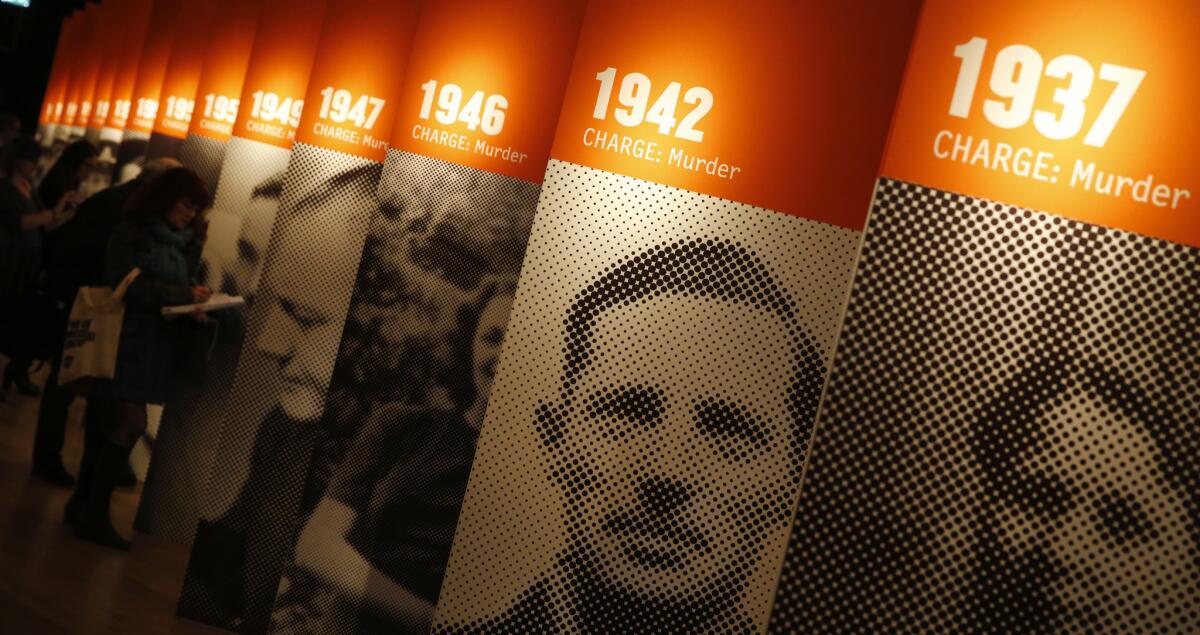 Members of the media look at exhibits during a preview of the Crime Museum Uncovered exhibition at the Museum of London on Oct. 7