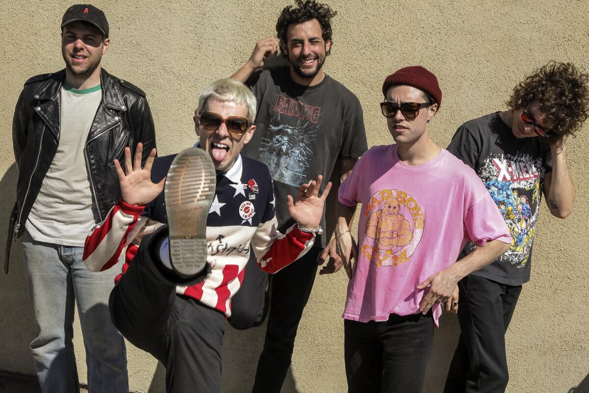 The Neighbourhood, from left: guitarist Jeremy Freedman, lead singer Jesse Rutherford, drummer Brandon Alexander Fried, guitarist Zachary Abels and bassist Michael Margott, shown in L.A. on March 29.