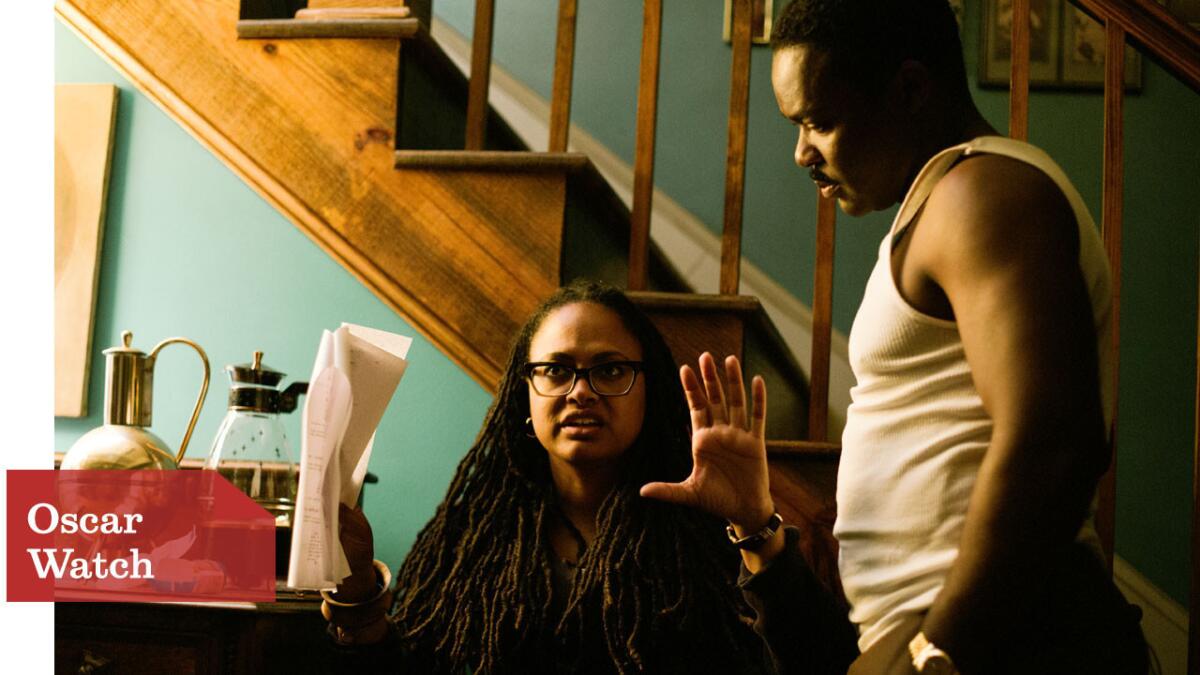 Director/Executive Producer Ava DuVernay discusses a scene with David Oyelowo (as Dr. Martin Luther King, Jr.) on the set of the movie "Selma."