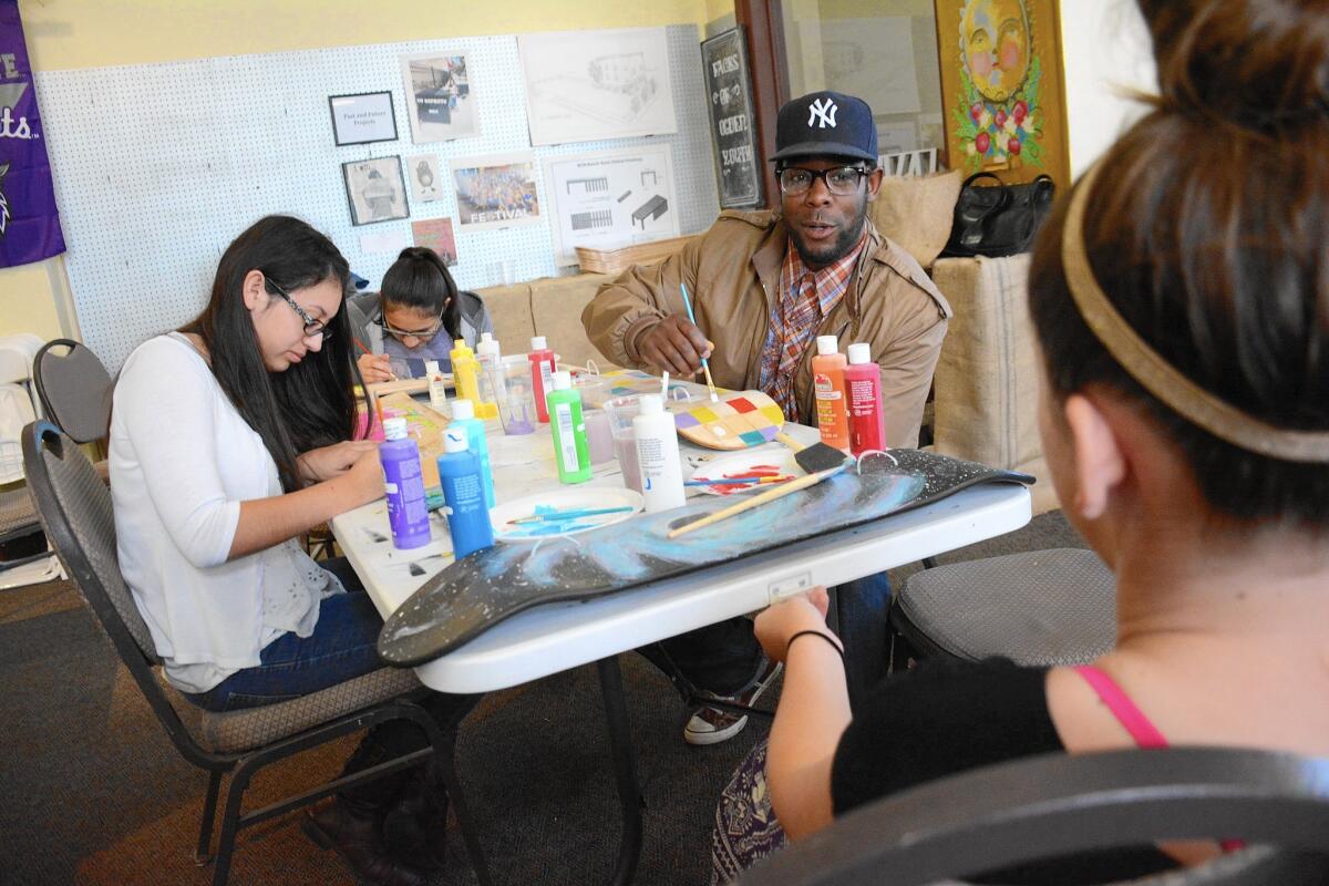 Amir Jackson, center, runs the Nurture the Creative Mind Foundation in Odgen, Utah. “There’s often not a lot of trust at first, so I make myself vulnerable. It’s easier to trust someone who’s vulnerable,” he said.