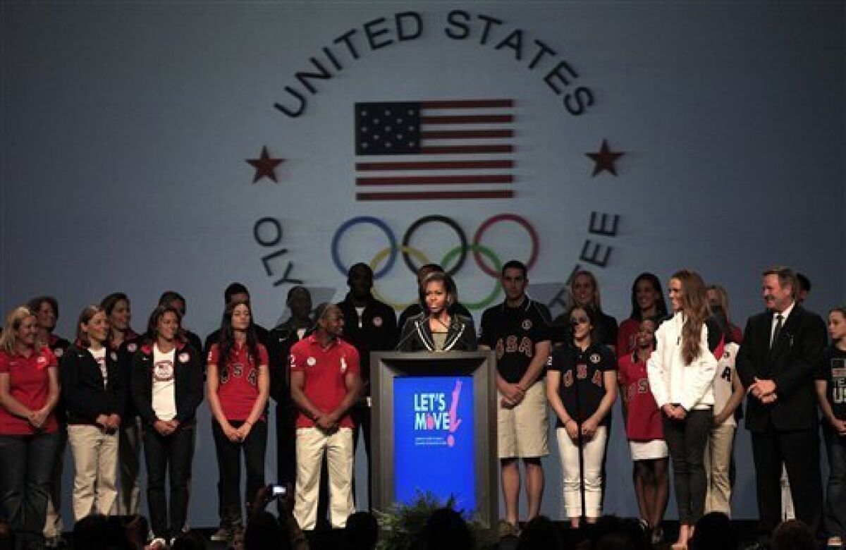 First lady Michelle Obama speaks during a news conference in Dallas, Monday, May 14, 2012, with athletes at the 2012 Team USA Media Summit. The first fady announced a new Let Move initiative to combat childhood obesity. (AP Photo/LM Otero)