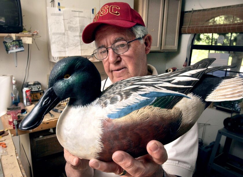 MIKE DOWELL holds a finished Shoveler (type of duck) he made earlier with extreme fine detail. U/T photo CHARLIE NEUMAN