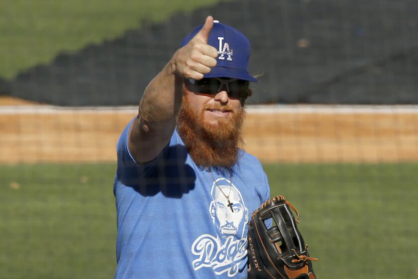 LOS ANGELES, CALIF. - JULY 3, 2020. Dodgers third baseman Justin Turner takes the field during practice at Dodger Stadium.