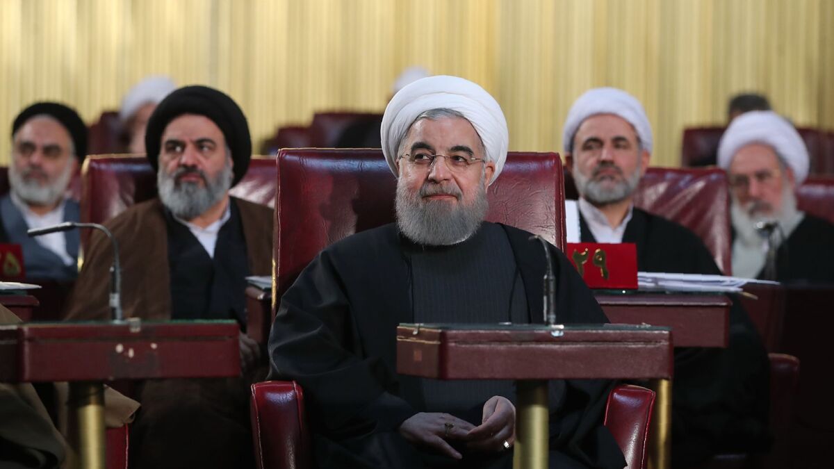 Iranian President Hassan Rouhani, center, is yet to face a credible challenger in elections scheduled for May 19.