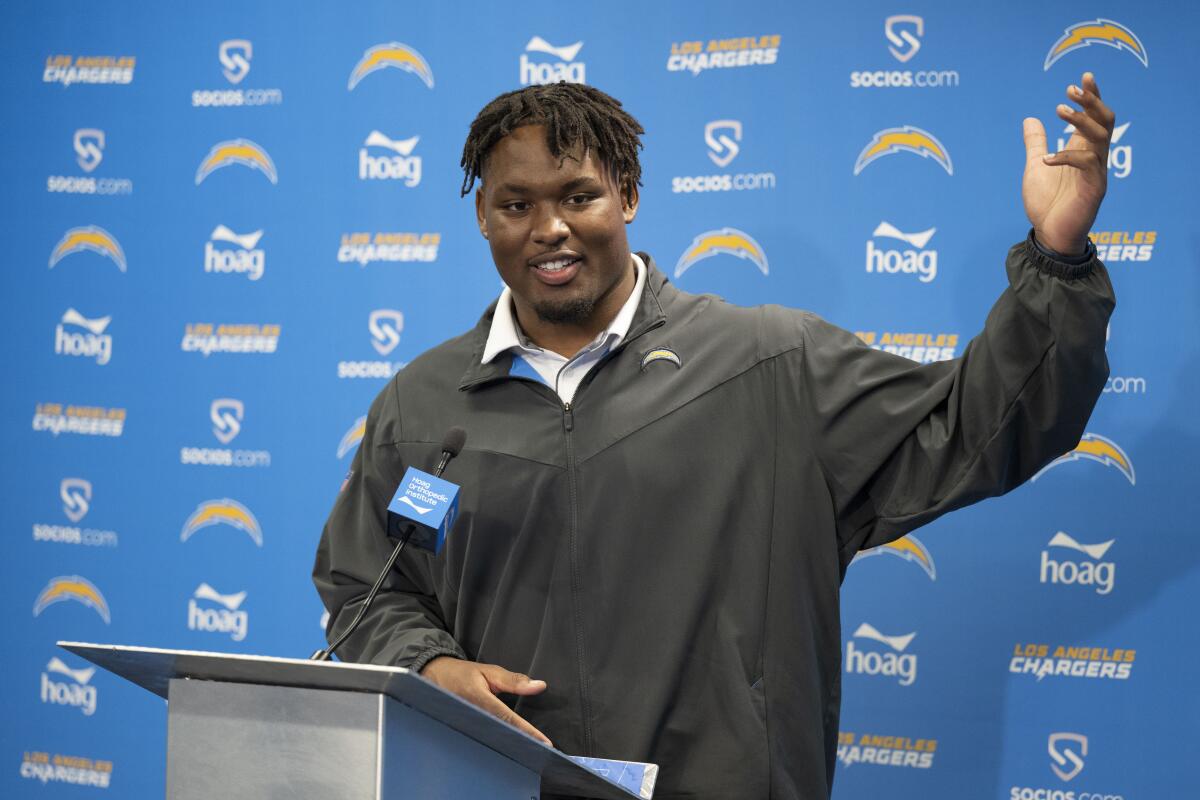 Chargers first-round draft pick Zion Johnson answers questions during a news conference.