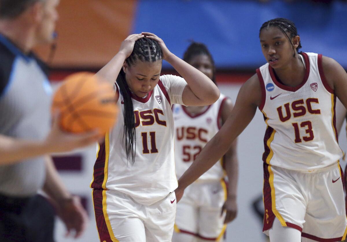 USC's Destiny Littleton, left, and Rayah Marshall react to a missed scoring opportunity in overtime of a 62-57 loss.