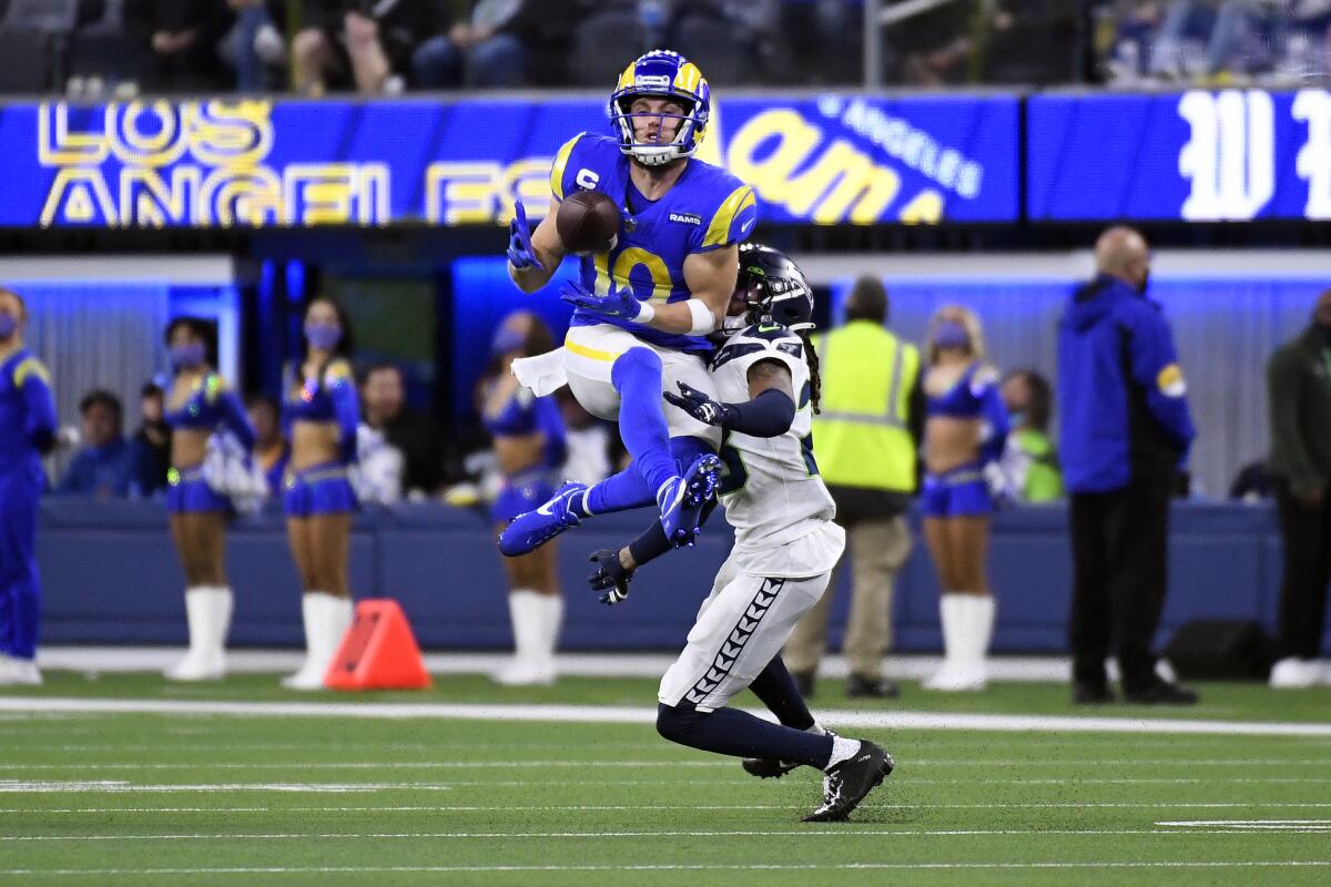 Rams wide receiver Cooper Kupp catches a pass in front of Seattle Seahawks cornerback Sidney Jones.