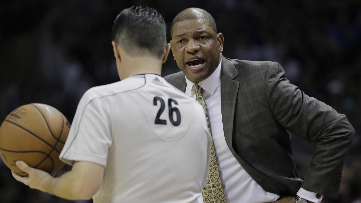 Clippers Coach Doc Rivers argues a call with referee Pat Fraher during the first half of Game 4 of the Western Conference quarterfinals against the San Antonio Spurs on April 26, 2015.