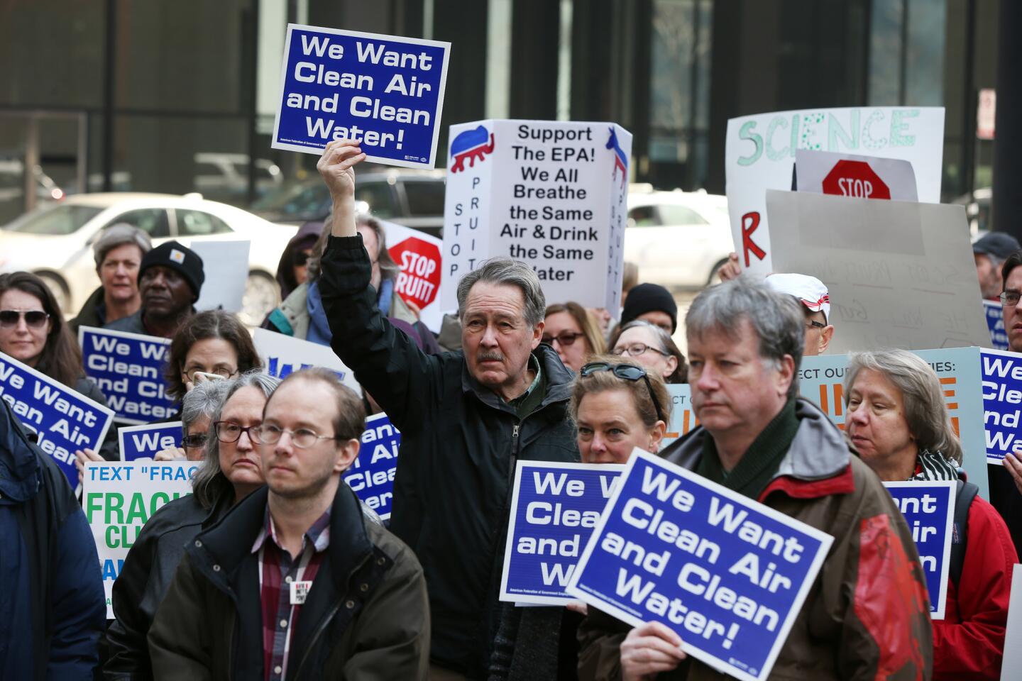 Larry Hoellwarth, center, joins Environmental Protection Agency staffers rallying in Federal Plaza in Chicago on Monday, Feb. 6, 2017, against the nomination of Scott Pruitt as agency head.