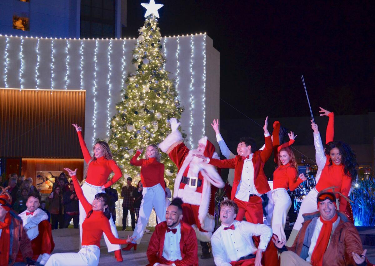 Thursday's VEA tree-lighting event included Asher Entertainment performers and Santa Claus.