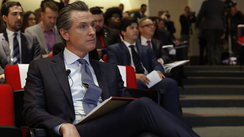 California Gov. Gavin Newsom waits to be introduced to present his first state budget during a news conference Jan. 10 in Sacramento.