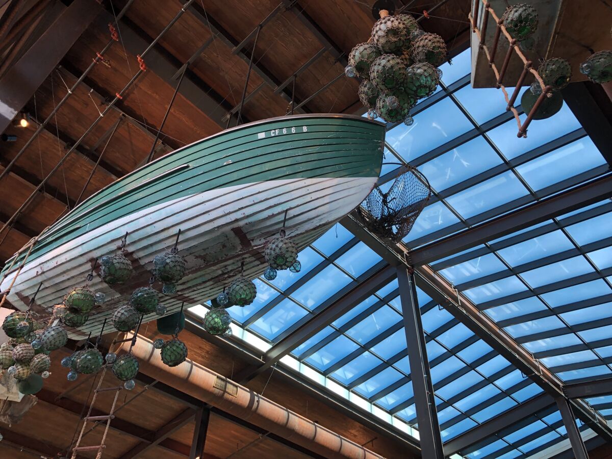 Old boats, fish traps and glass floats hang from the 35-foot ceiling in Sky Deck.