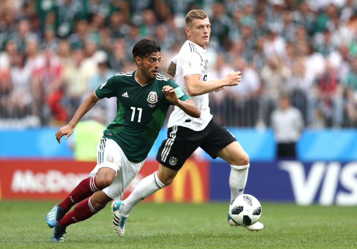 Carlos Vela of Mexico is challenged by Toni Kroos of Germany during the 2018 FIFA World Cup Russia group F match between Germany and Mexico at Luzhniki Stadium on June 17, 2018 in Moscow, Russia.