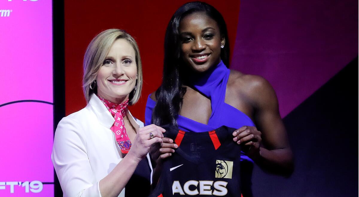 NJackie Young poses for a photo with WNBA executive Cristi Hedgpeth after being selected by the Aces with the No. 1 pick in the draft Wednesday.