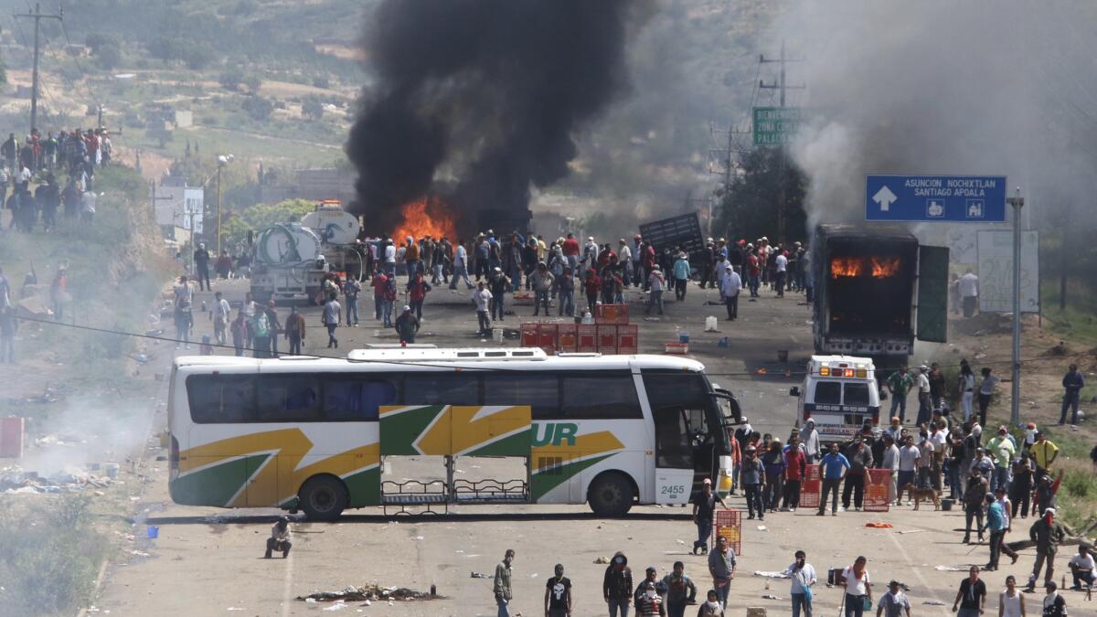 Several vehicles were torched during the unrest in Nochixtlan in June. (Luis Alberto Hernandez / Associated Press)