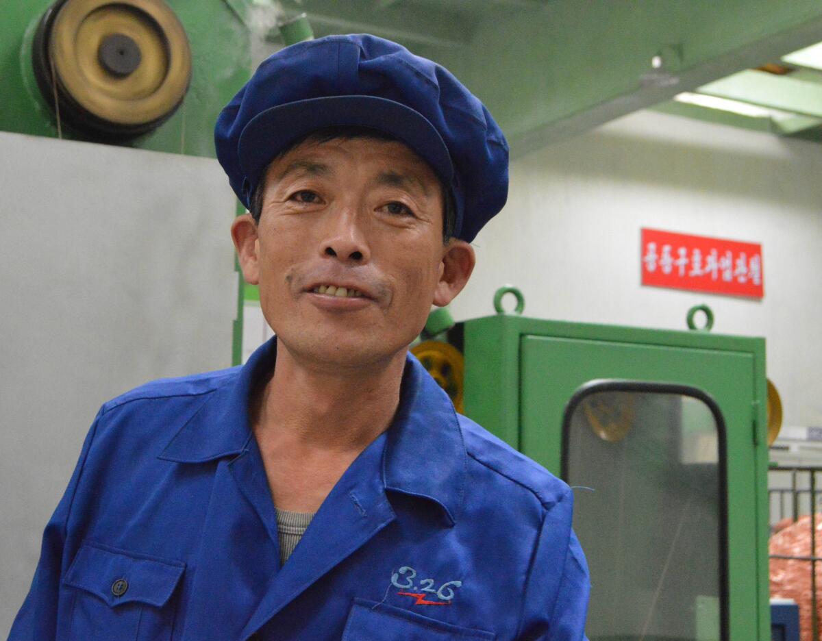 Ri Song Il, 50, said he had worked at the factory for 25 years. His salary is 300,000 won per month. At the unofficial exchange rate of 8000 won per dollar, that’s $37.50 a month. A bicycle at a Pyongyang Department store costs about twice that much. (Julie Makinen / Los Angeles Times)