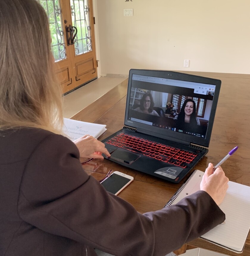 RSF Women's Fund Grant Committee Co-Chair Cynthia Hudson keeps the organization on task by testing out online video conferencing applications with Mara Buchholz, incoming grants chair, and Nikki Ream, moderator for video site visits.