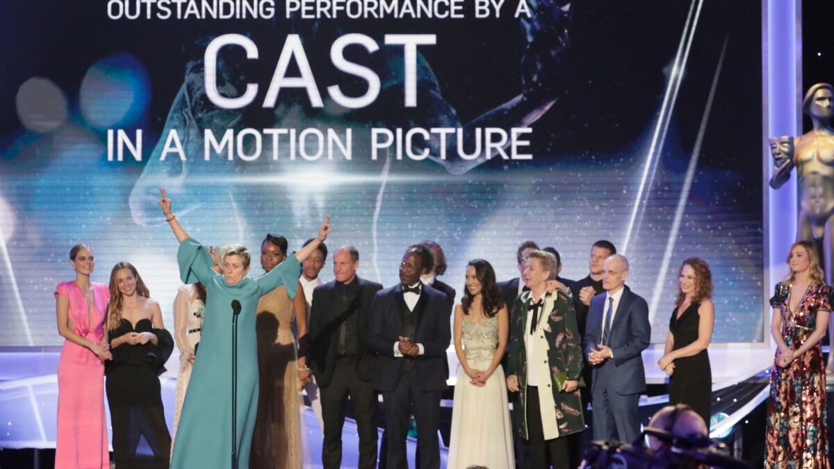 Frances McDormand takes the stage with the cast and crew after winning outstanding performance by a cast in a theatrical motion picture for "Three Billboards Outside Ebbing, Missouri."
