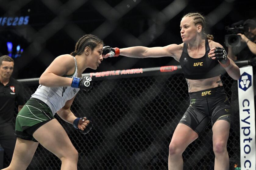 Valentina Shevchenko throws a right at Alexa Grasso, left, during a UFC 285 mixed martial arts flyweight title bout Saturday, March 4, 2023, in Las Vegas. (AP Photo/David Becker)