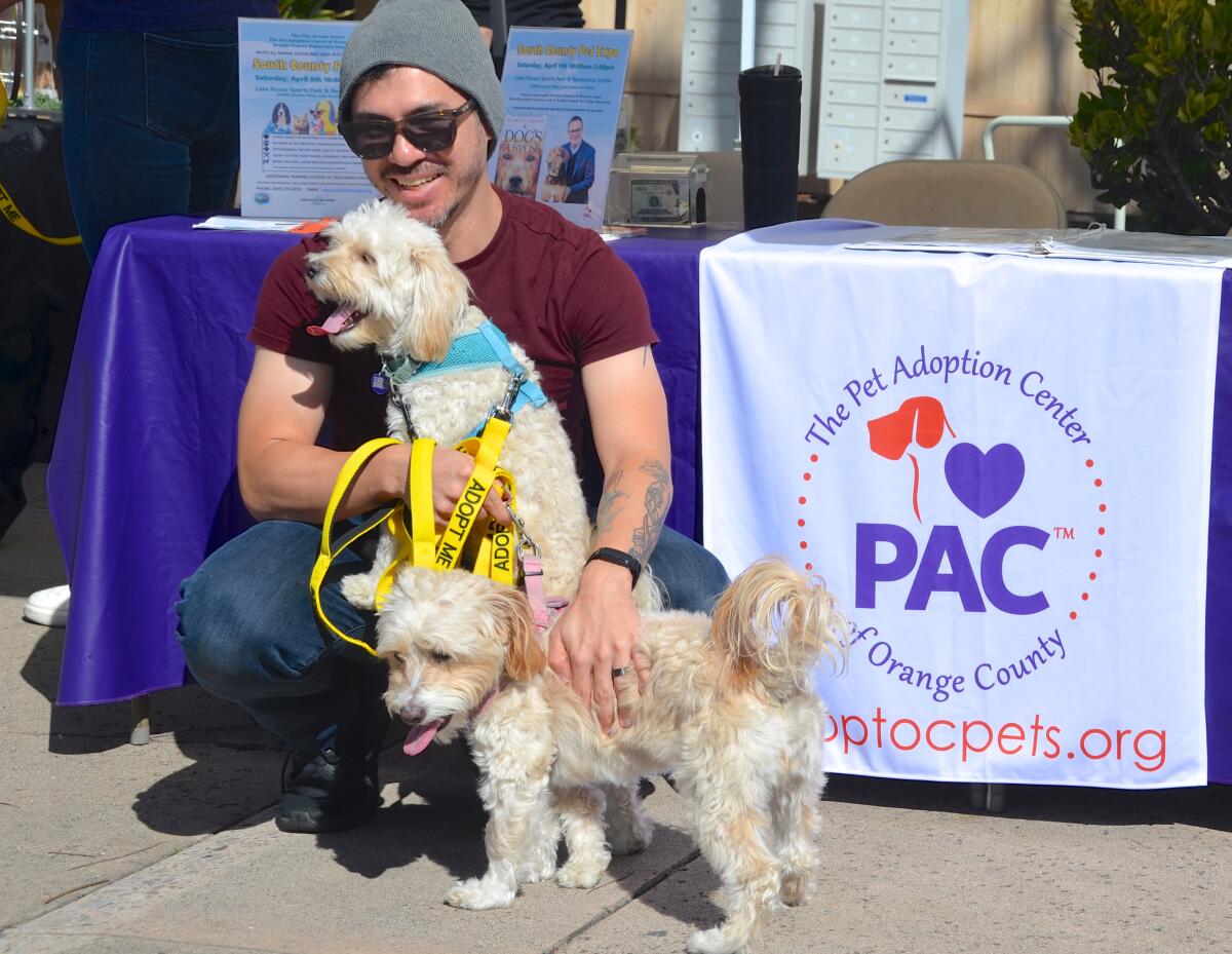 PAC volunteer Derek Yesionowski, with Benzy in arms and Mixie.