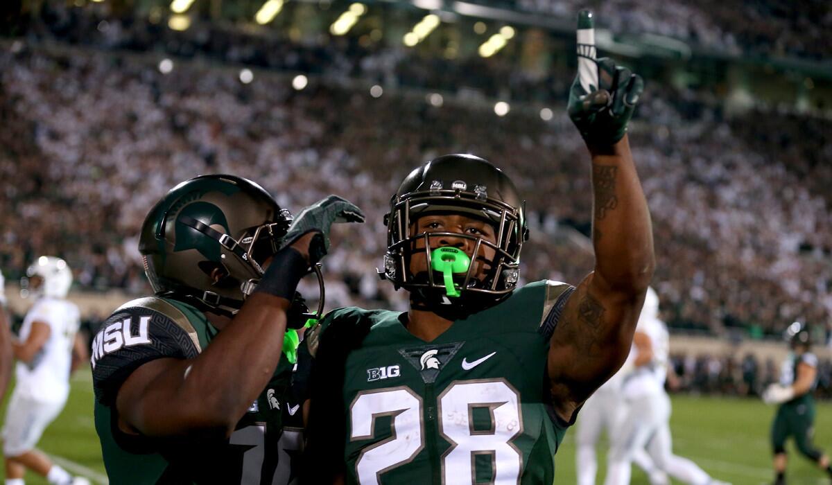 Michigan State's Madre London reacts after a run against the Oregon Ducks during their game on Saturday.