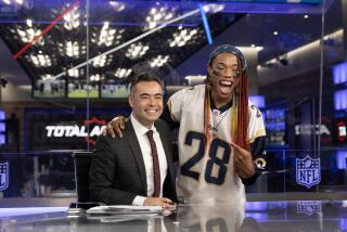 Inglewood, CA - July 28: BrandElsa Pereira, right, summer associate with Rainbow Labs, takes a photo with Mike Yam, NFL network host, after watching live recording of NFL Total Access program in the newsroom at NFL Studios in Inglewood Friday, July 28, 2023. Rainbow Labs addresses the unique challenges faced by queer and gender non-conforming youth. They visited the NFL Studios to dive into the world of content creators, studio production and witness the live taping of NFL Total Access. (Allen J. Schaben / Los Angeles Times)