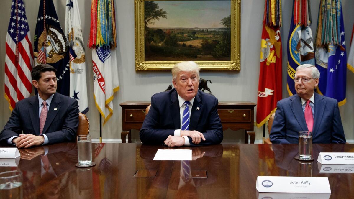 House Speaker Paul Ryan, R-Wis., left, and Senate Majority Leader Mitch McConnell, R-Ky., right, meet with President Donald Trump at the White House on Sept. 5.