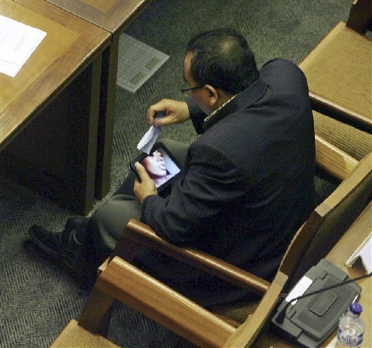 Indonesian lawmaker caught watching porn resigns - The San Diego  Union-Tribune